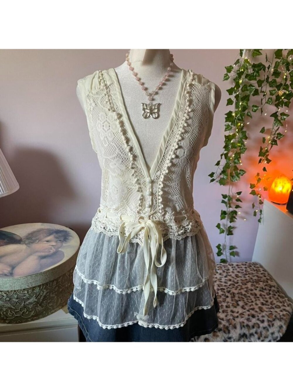 Lacy button up top with ribbon detail and tie at the waist